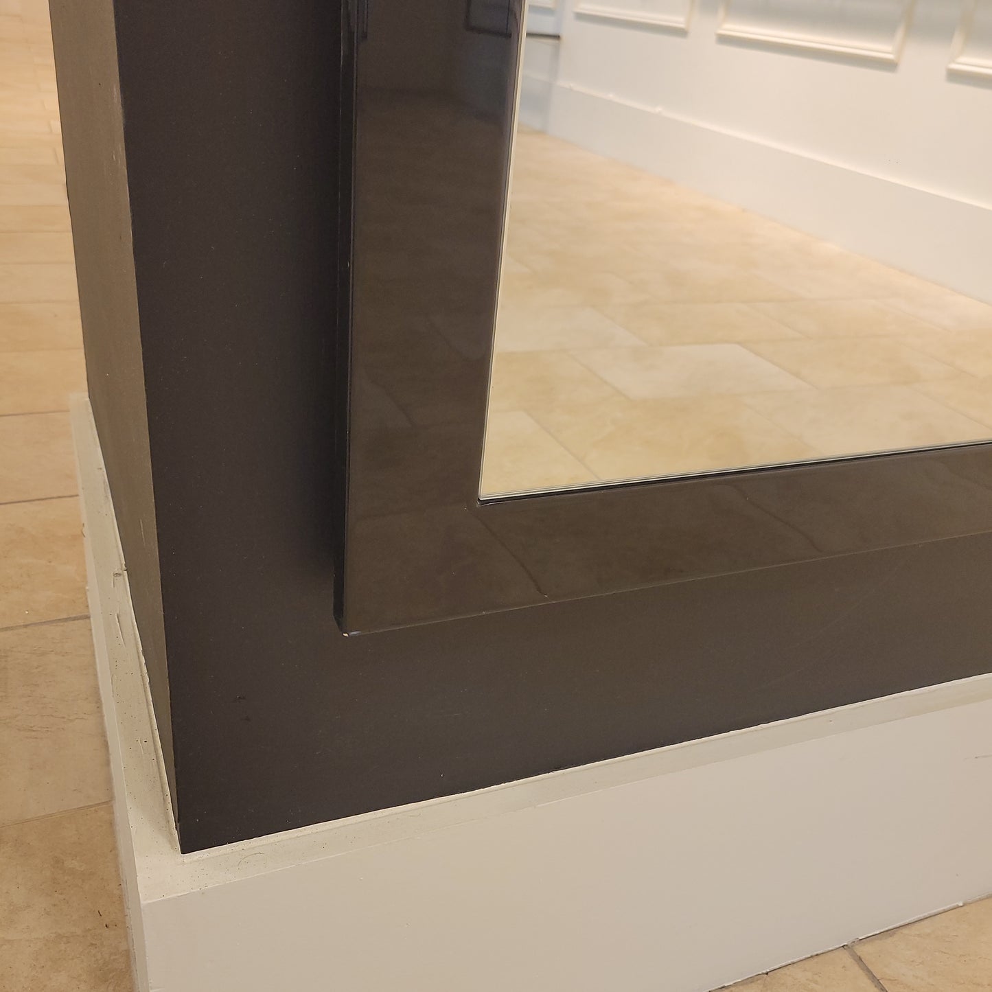 Tall mirror with black framing